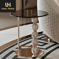 Décoration de salon de luxe en métal noir avec cadre en acier inoxydable ensemble table d'appoint ronde en verre avec plateau central
