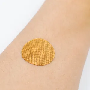 Benda in gesso per iniezione OEM di colore della pelle fasciatura rotonda in tessuto non tessuto PE all'ingrosso bandaid per la guarigione rapida delle ferite