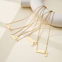 Collier personnalisable en acier inoxydable plaqué or 18 carats PVD, avec pendentifs cœur, papillon et infini gravés, style classique et minimaliste