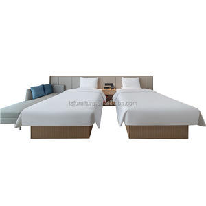 Juego de Muebles de Dormitorio Doble Completo Personalizado para Hotel, Cama de Madera con Cabecera Larga a Juego y Sofá Lateral para Proyecto de Hotel de 3 Estrellas - Product Image 1