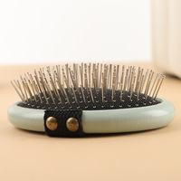 Brosse démêlante massante en bois à coussin d'air avec picots en acier inoxydable pour toilettage de chats et chiens, vente en gros