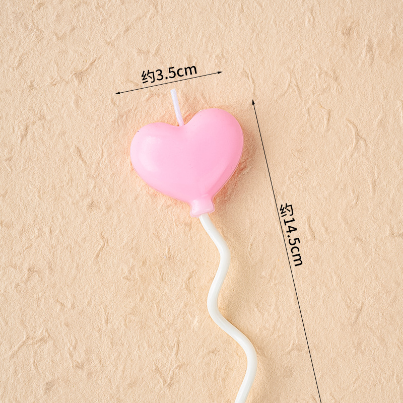 Ballons roses en forme de coeur