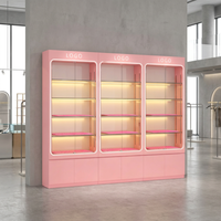 Vitrine de présentation en verre rose personnalisée avec éclairage LED, pour cosmétiques et parfums, avec armoires de rangement pour les magasins de beauté et les boutiques de détail