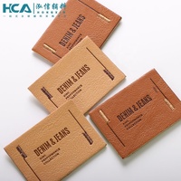 Étiquettes personnalisées en cuir PU denim avec logo en creux et à la main pour jeans