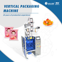 Machine d'emballage verticale multifonctionnelle pour bonbons gélifiés et biscuits, avec plateau tournant de dosage