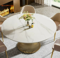 Table à manger ronde de luxe avec plateau en marbre et structure en acier inoxydable brossé doré pour la maison et l'hôtellerie