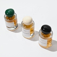 Vente en gros de flacons de parfum ronds en verre vides de 30 ml, 50 ml et 100 ml avec un nouveau design de bouchon