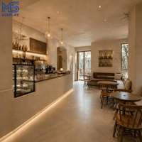 Comptoir de café personnalisé de style Wabi Sabi avec vitrine à pâtisserie pour projet d'aménagement intérieur de café-boulangerie