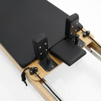 Mesin Pilates Reformer Lipat Kayu Oak untuk Latihan di Studio Gym dengan Carriage yang Halus dan Footbar yang Dapat Disesuaikan