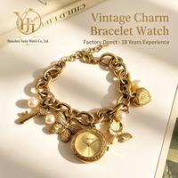 Montre-bracelet vintage élégante en alliage avec breloques pour femme, montre-bracelet à quartz rétro avec papillon et cœur, vente en gros de bijoux-montres