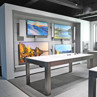 Vitrine d'exposition personnalisée pour téléphones portables avec grande table d'expérience en îlot pour magasin de détail d'accessoires électroniques modernes