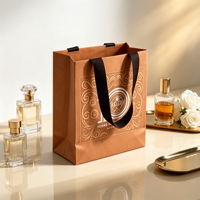 Sac cadeau en papier kraft écologique personnalisé, ruban en coton, impression de logo OEM pour l'emballage de cosmétiques, de parfums et de bijoux, vente en gros