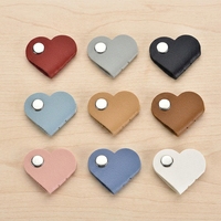 Organisateur de câbles mignon en forme de mini-cœur, support portable en cuir PU pour écouteurs, accessoire de fixation de câbles en gros pour usage quotidien