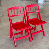 Chaises pliantes en résine Napoléon pour la location de mobilier commercial en gros pour mariages, banquets et événements en extérieur