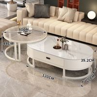 Ensemble de tables basses modernes rondes et ovales imbriquées avec tiroir de rangement, plateau en pierre frittée et structure métallique pour l'ameublement de la maison