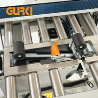 Machine d'étiquetage et de scellage automatique GURKI GPETB-40 pour cartons, avec entraînement supérieur et inférieur