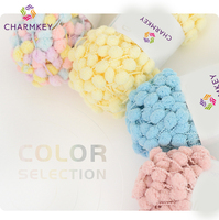 Vente chaude taille moyenne 16mm couleurs fantaisie pompons 100% Polyester pop-corn pompon fils pour couverture tricot