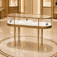 Table de présentation ovale en métal doré avec vitrine en verre trempé, comptoir de luxe pour bijouterie, pour l'affichage de colliers, bagues et boucles d'oreilles