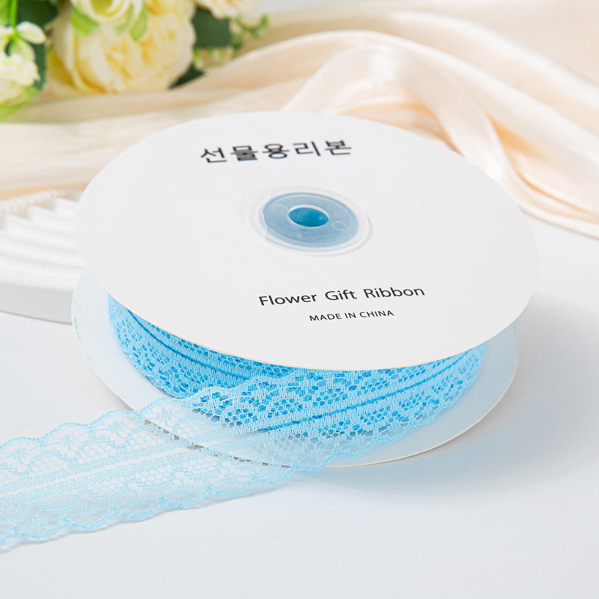 เข็มขัดลูกไม้สีฟ้าอ่อน 3 ซม. 50 หลา