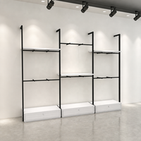 Présentoir à vêtements double niveau en métal noir avec tringle de suspension, étagères et tiroirs inférieurs – Vente en gros