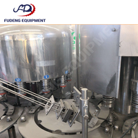 Machine de remplissage d'eau pure d'occasion, 12 têtes de remplissage, précision de remplissage de 99 %, fonctionnement simple, économie d'énergie, prix compétitif, 4000 bph