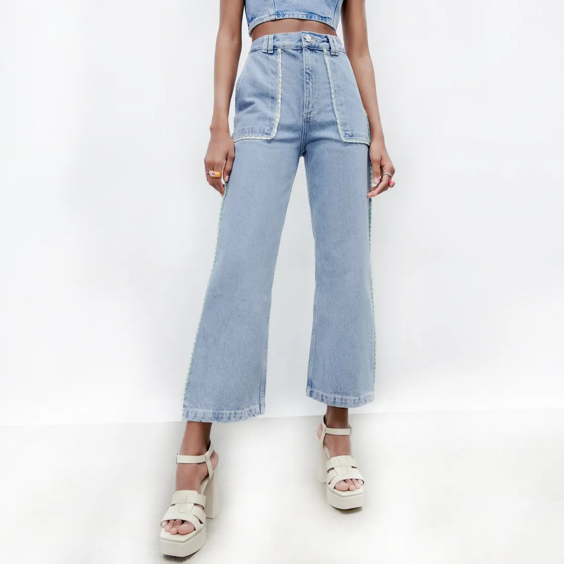 Denim Jeans Bekleidungs hersteller Benutzer definierte hochwertige Spitzen besatz um die Tasche breites Bein Baumwolle Denim Hosen Jeans Frauen