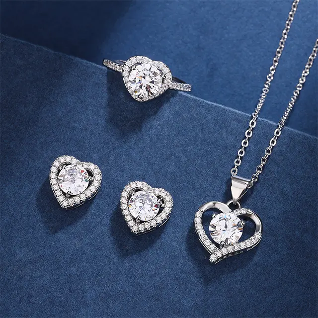 Conjunto de joyas creativas de gama alta con incrustaciones huecas en forma de corazón, collar de mosonita, anillo, pendiente