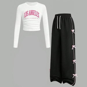 Ensemble décontracté 2 pièces pour adolescentes : Haut blanc à manches longues imprimé lettres et pantalon large noir à nœud latéral – Tenue pour enfants OEM ODM - Product Image 1