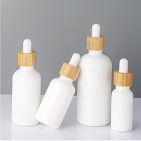 10ml 20ml 30ml 50ml 100ml Harga Grosir Botol Minyak Esensial Porselen Putih dengan Penetes Bambu dan Tutup Kayu, Logo Dapat Disesuaikan