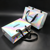 Sacs shopping en papier holographique métallisé scintillant avec poignée en ruban noir pour les boutiques de vêtements de marque