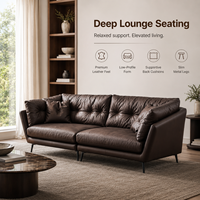 Canapé lounge en cuir capitonné marron avec coussins profonds et pieds en métal noir pour salon, hôtel, appartement