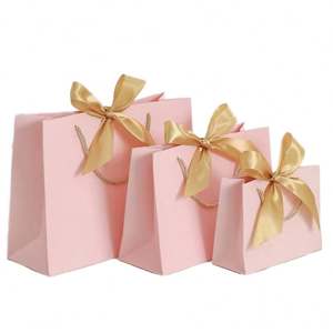 Sacs shopping en papier personnalisés noir et bleu avec nœud papillon et logo estampé à chaud or pour l'emballage de vêtements, chaussures et bijoux - Product Image 1