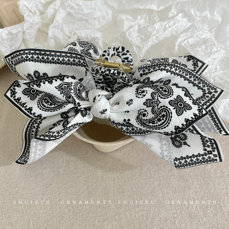 Fermaglio per capelli con fiocco a forma di fiore di anacardio