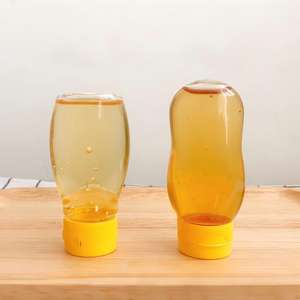 Bouteille de <span class=keywords><strong>miel</strong></span> mini en plastique PET de 72 ml 100 g, pot d'emballage vide, bouteille souple pour <span class=keywords><strong>miel</strong></span>, petit récipient sérigraphié avec bouchon en silicone - Product Image 1