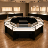 Vitrine à bijoux en verre octogonale personnalisée, cadre noir, finition dorée, éclairage LED pour magasin de détail, boutique, distributeur en gros