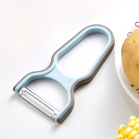 Éplucheur de légumes ergonomique avec poignée antidérapante en acier inoxydable, design moderne pour la maison et la restauration, idéal pour les pommes de terre, les pommes et les carottes