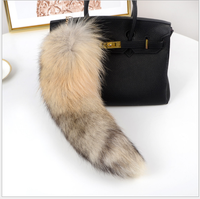 Véritable prix de gros de luxe Porte-clés en fourrure de queue de renard Porte-clés en fourrure de queue de renard véritable Pendentif de sac d'approvisionnement d'usine en gros