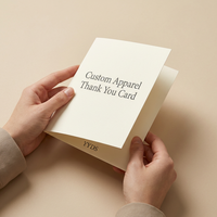 Tarjetas de agradecimiento personalizadas para ropa, color crema marfil, plegables, con impresión minimalista en serifo, inserto de marca, consejos de cuidado y código QR para boutiques de ropa.