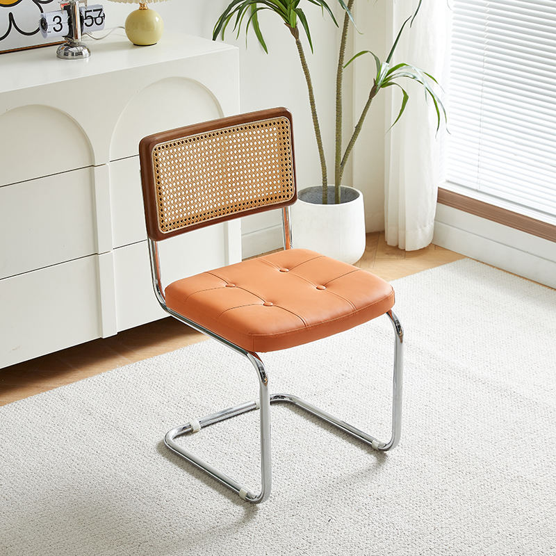 Brown wooden backrest and orange seat cushion