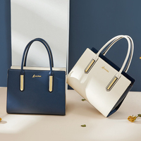 Bolso de mano de piel de vaca auténtica para mujer, bolsa de mano femenina de color contrastante, a la moda, precio al por mayor, 2022