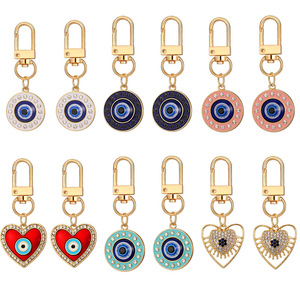 yeguang Ensemble de <span class=keywords><strong>12</strong></span> porte-clés en forme de cœur avec motif œil de démon, pendentif géométrique ajouré en alliage - Product Image 1