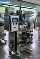 Machine d'emballage de grande capacité pour poudres granulées et snacks, idéale pour les chips de pommes de terre, les chips de bananes, les pistaches, les fruits secs et les sachets alimentaires en aluminium.
