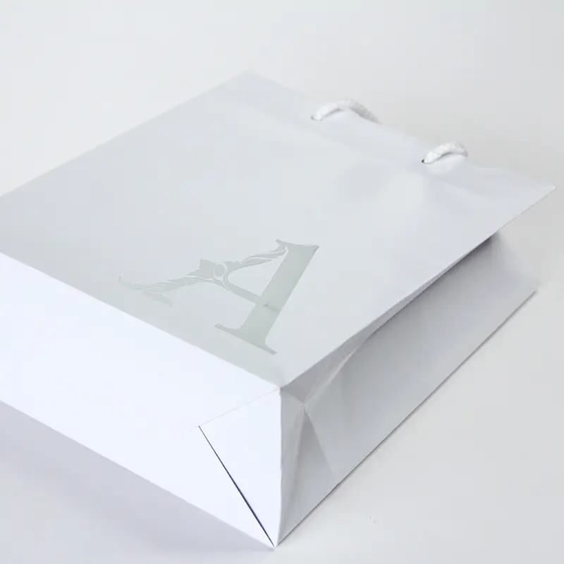 Wholesale Custom Luxury Personal Store Logo Printed Custom Paper Bags For Clothing Packaging