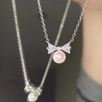 Collier avec pendentif en forme d'arc en acier inoxydable, incrustation de perles simulées et de strass, chaîne argentée, bijoux pour femmes, accessoires de mode