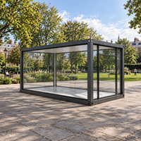 Serre en verre préfabriquée, pièce de jardin modulaire avec structure en acier et murs vitrés pour usage extérieur