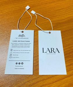 A simple and versatile new thickened beige card-style clothing hang <b>tag</b>, a disposable tamper-evident clothing label hang <b>tag</b> - Product Image 5