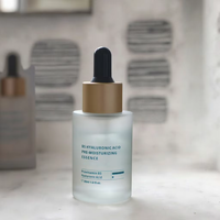 Sérum pour le visage à l'acide hyaluronique hydratant de marque privée OEM ensemble de soins de la peau pure et non grasse pour la réparation du visage sous forme de liquide blanchissant