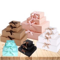 Supporta il cartone a conchiglia nero di alta qualità progettato su misura con confezione regalo decorata con fiocco