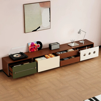 Meuble TV de style Mid-Century, armoire sans poignée à blocs de couleur avec décor rond évidé, tiroirs mixtes et rangement fermé pour appareils multimédias