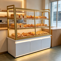 Vitrine de boulangerie commerciale, présentoir à pain en verre avec cadre doré, éclairage LED et rangement inférieur, sur mesure pour boulangerie